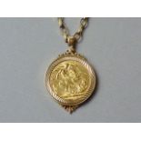 A 1913 gold sovereign, held in a heavy yellow-metal pendant mount, on a 9ct gold belcher link neck