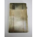 An early Elizabeth II silver cigarette case, of rectangular form with engine turned decoration,