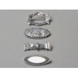 Four Victorian and later silver brooches, one in the form of a stylised wreath, 15g