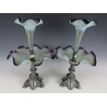 A pair of 19th Century epergnes, each comprising an achromatising purple rimmed vaseline flute