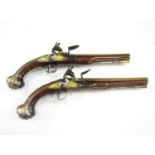 A pair of silver-mounted brass-barrelled flintlock holster pistols by John Henshaw of Cambridge,