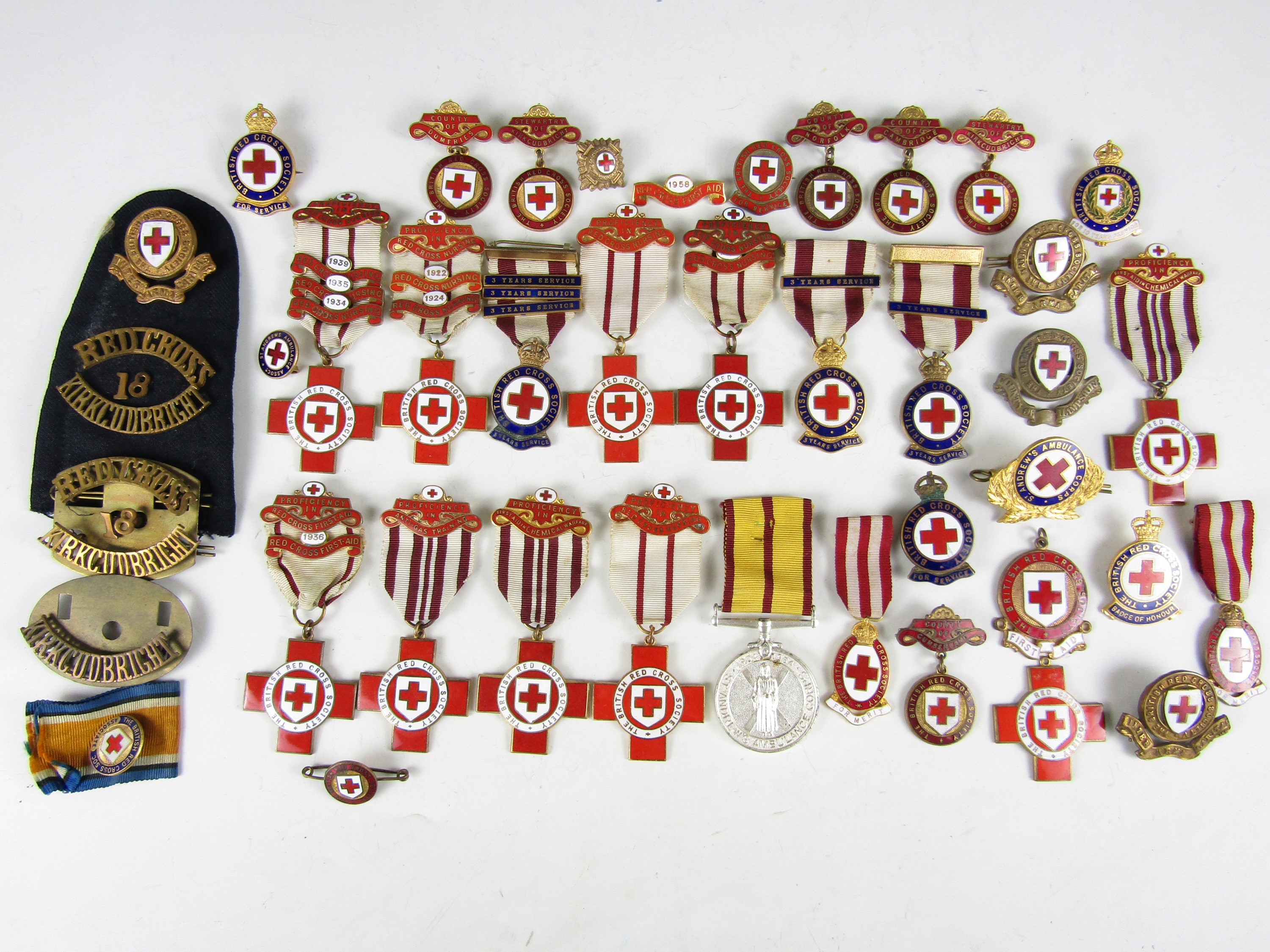 A large quantity of Red Cross and similar medals and insignia