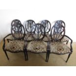 A suite of seven Victorian Hepplewhite style salon / dining chairs, comprising three arm chairs