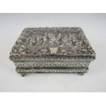 A late 19th Century Dutch silver trinket box, the hinged lid cast in a high relief depiction of a