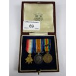 A mounted miniature 1915-15 Star, British War and Victory medal group with oak leaf clap, in