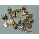 A 9ct gold charm bracelet with padlock clasp, agate and other charms, 75g total weight