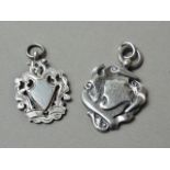 Two Victorian and later silver fob medallions, one engraved with a monogram, Birmingham 1897 and