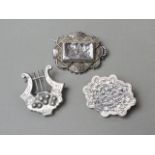 Three Victorian silver brooches, one in the form of a lyre, two with assay marks, test as silver,