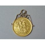 An 1887 Victorian Jubilee head 22ct gold two pound coin, on a yellow metal pendant mount, 17.5g