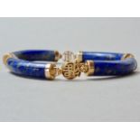 A Chinese lapis lazuli and yellow-metal bracelet, the polished hardstone links interspersed by