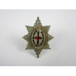 A Coldstream Guards officers' silver and enamel badge, JRG, Birmingham, 1959, 36 mm high