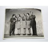 [Autograph / The Andrews Sisters] Large signed studio photograph from the film Buck Privates (1941),