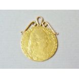 A George III gold spade guinea, mounted as a pendant, 8.9g total weight