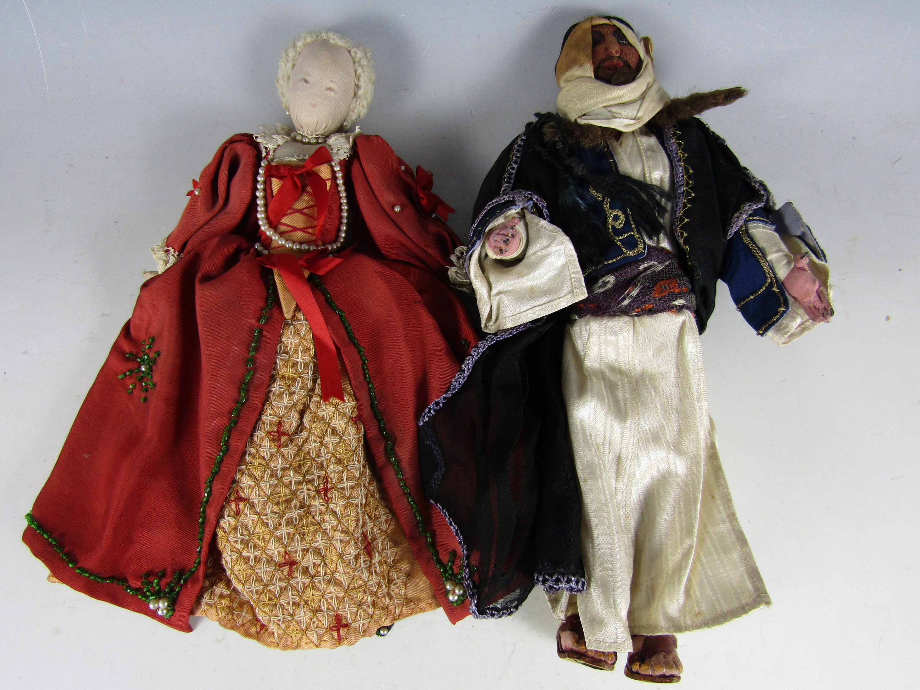 Two vintage hand constructed cloth dolls, one modelled as an Arabian prince, of cotton covered