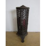 A Victorian cast iron paraffin conservatory heater, cast in an aesthetic-influenced faux-bamboo