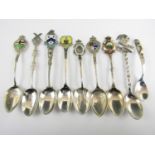 Nine Victorian and later enamelled silver souvenir teaspoons, 117g