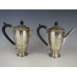 A George V silver coffee and hot water pot, each of slender inverted baluster form raised over a