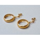 A pair of 9ct gold pendant hoop earrings, each with a stud suspender and dependant annulus, 2.5g