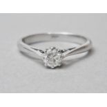A contemporary diamond solitaire ring, the brilliant cut stone of approximately 0.16ct, crown and