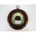 A late 19th Century carved mahogany circular barometer