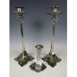 A WMF candlestick together with a pair of contemporary electroplate candlesticks
