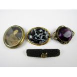 Victorian brooches including one faux jet bar brooch mounted in yellow metal and split seed