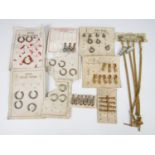 A quantity of vintage new-old-stock watch chain T-bars, swivels, pocket watch bows etc