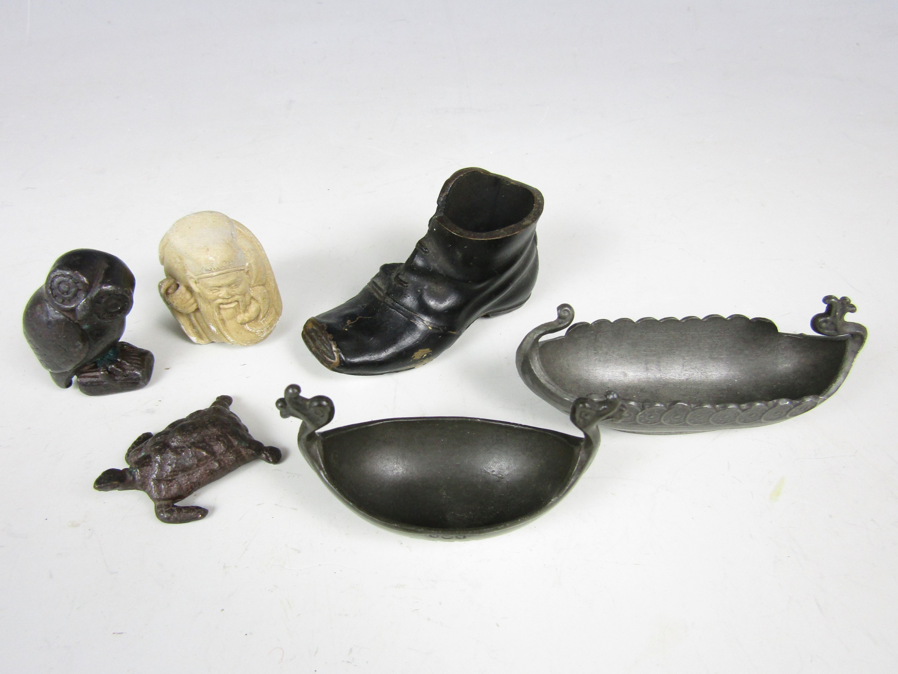 Sundry metalware including a bronze boot match holder together with an owl and two pewter