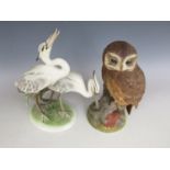 An Aysnley tawny owl figurine together with a Wein figurine of storks