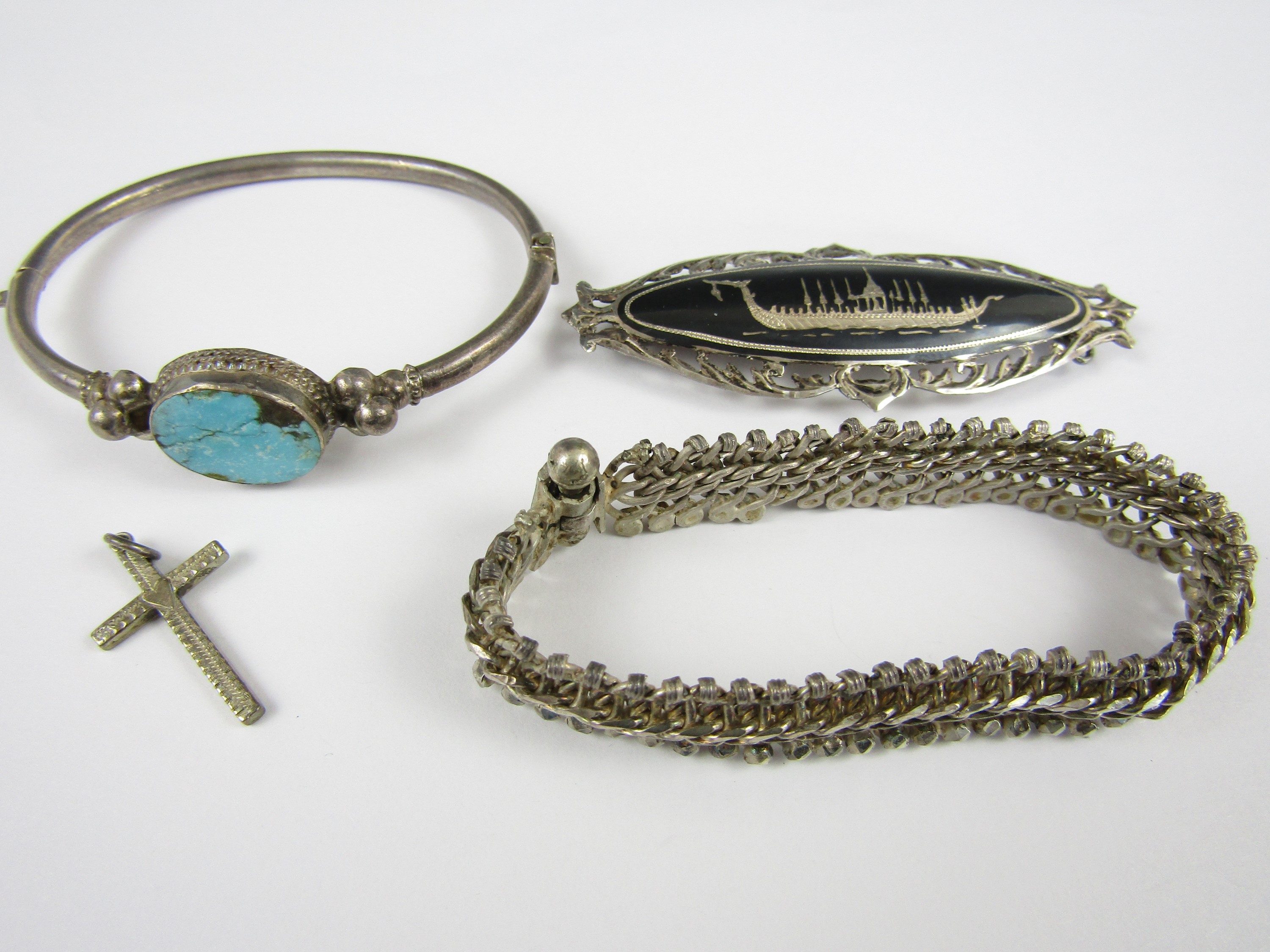 Vintage white metal jewellery, including turquoise bangle, a Thai white metal brooch, a cruciform