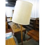 A vintage teak standard lamp