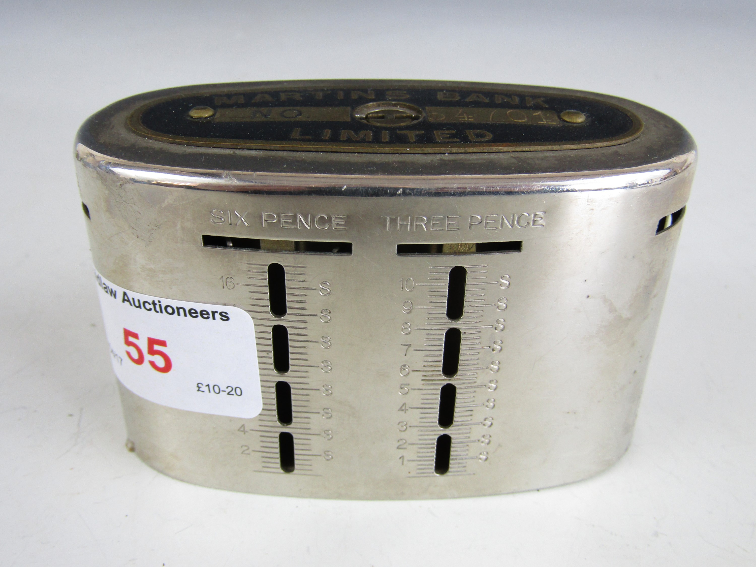 A Martins Bank Limited money box with key