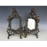 A pair of Art Nouveau bronzed iron picture frames manufactured by Beatrice, shape number 1007A and