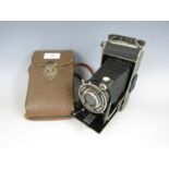 A vintage FW Pronto folding roll-film camera with case