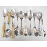 A quantity of electroplate preserve and fruit spoons including bright cut and floral patterns