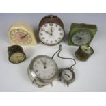 An Early Bird clock together with others