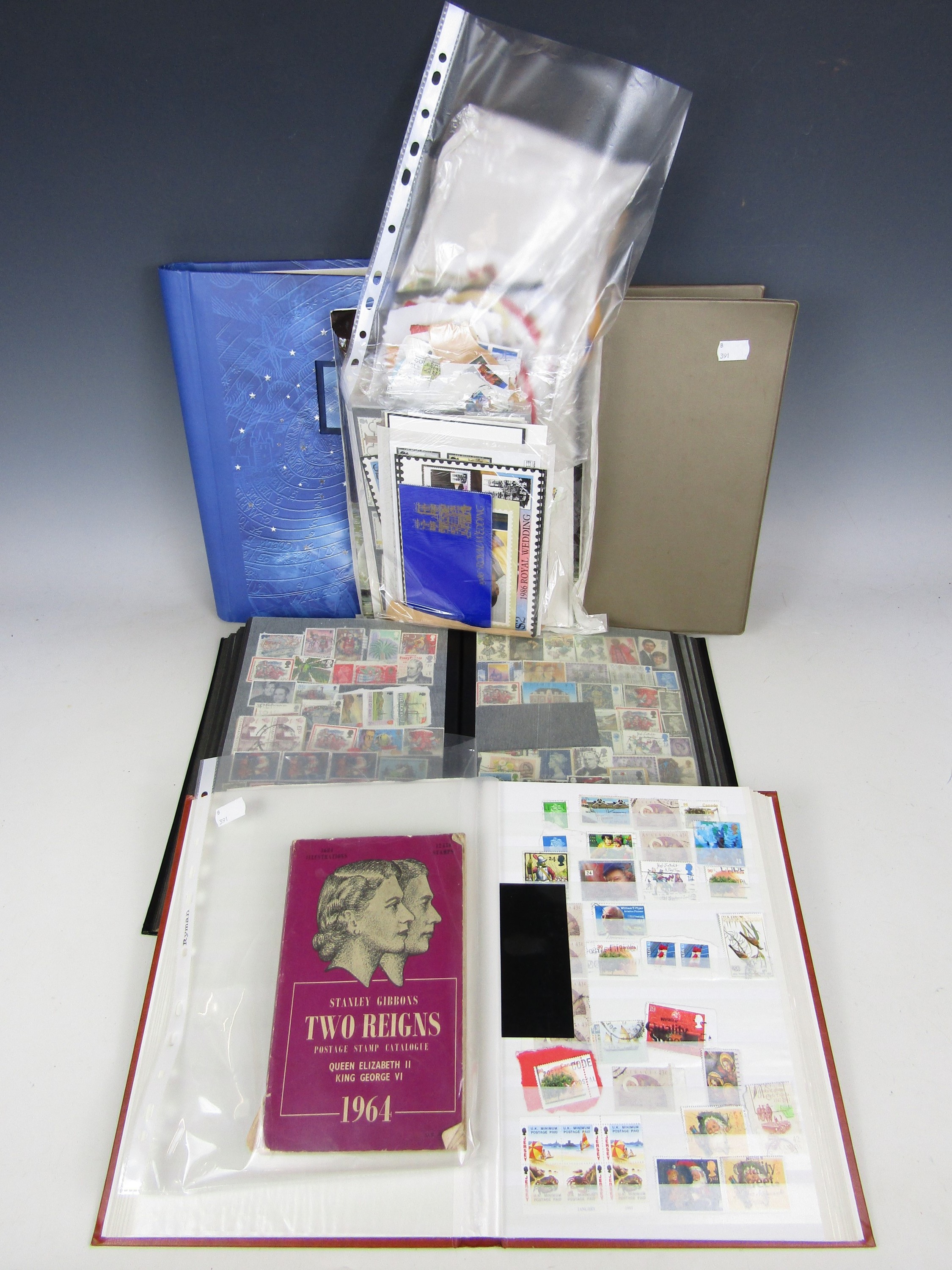 Four stamp albums and contents together with First Day Covers, a book and a cigarette card album