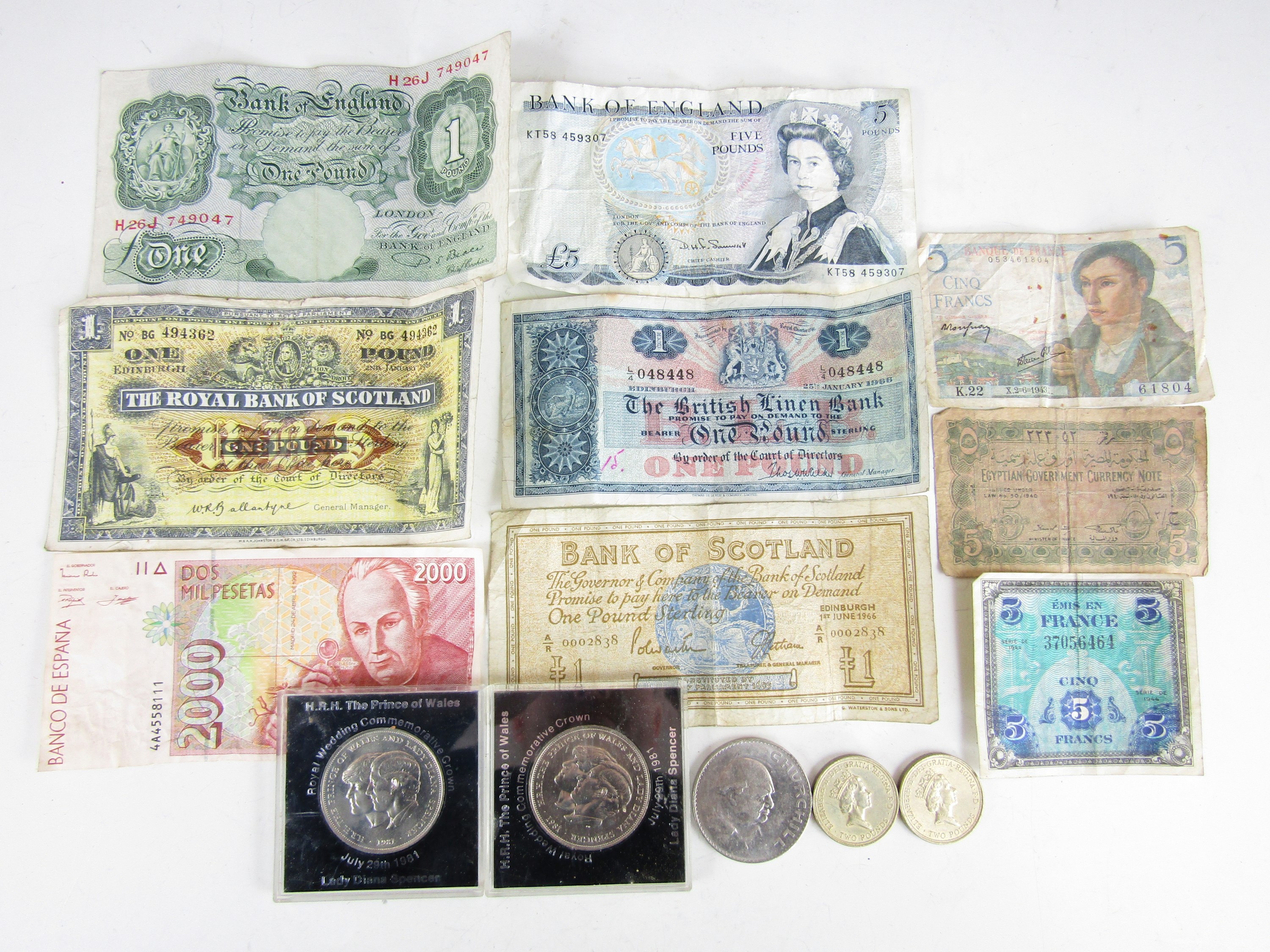 A quantity of Bank of England notes together with three commemorative crowns etc.