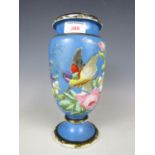 A 19th Century milk glass vase hand decorated with a song bird and blossoms