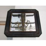 An ebonized wall mirror, 46 x 41 cm