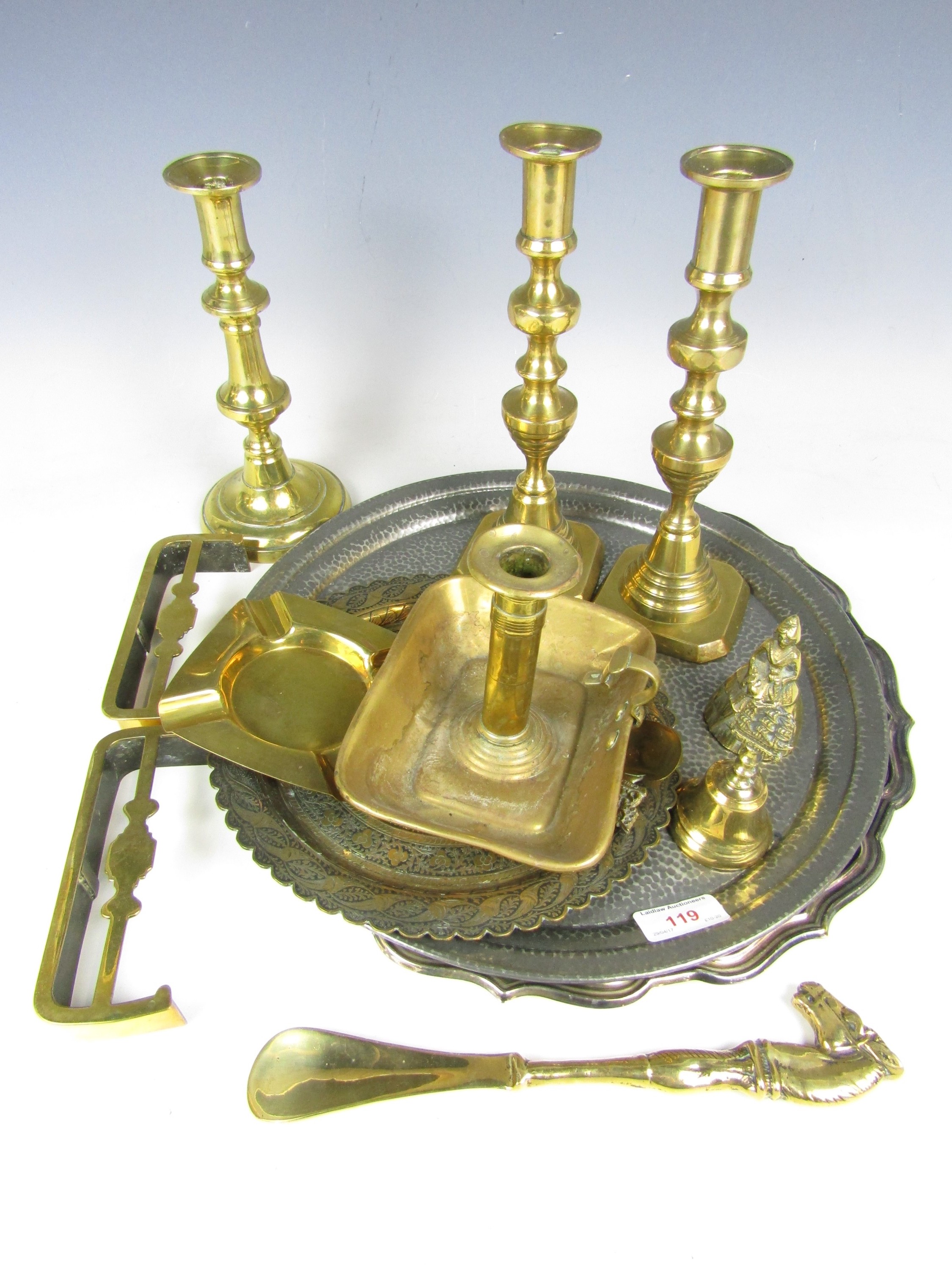 A quantity of brass and electroplate including three brass candlesticks, a brass chamberstick, small