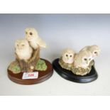 A Border Fine Arts figurine depicting a pair of owlets on a tree stump together with a figurine of a