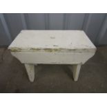 A vintage painted wooden stool