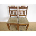 A pair of oak Arts and Crafts style chairs