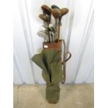 A vintage golf bag with clubs