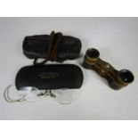 A pair of vintage pince-nez reading glasses together with a pair of opera glasses