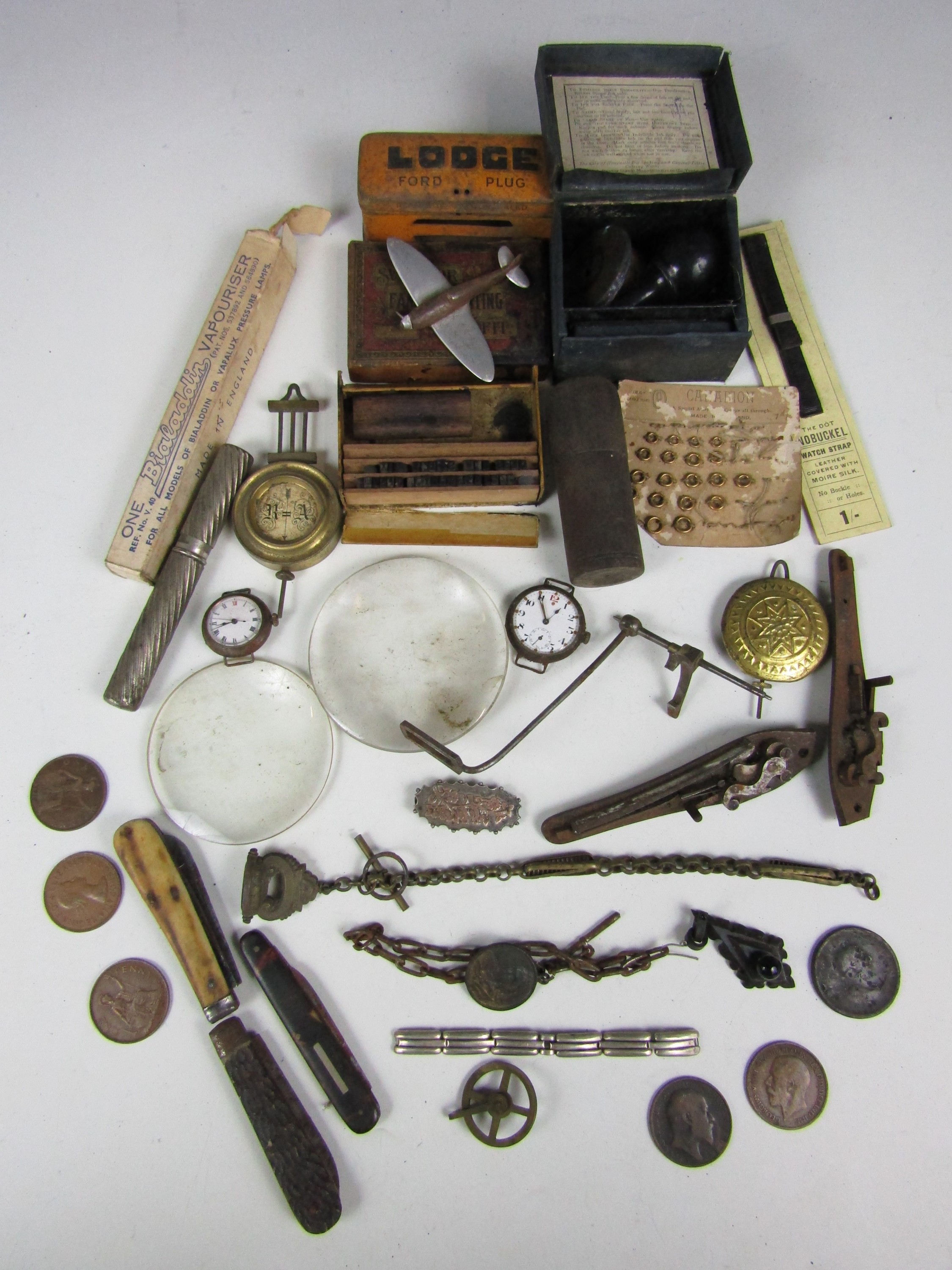 Sundry collectors’ items including watch parts, coins, two magnifying lenses and pen knives etc.