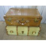 A large vintage leather luggage case together with a cabin trunk