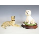 A Border Fine Arts figurine of a West Highland terrier, MT 10, together with one other of a