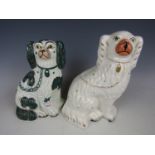 Two Staffordshire type dog figurines